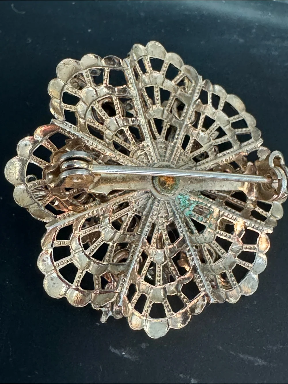 Gold-Tone Floral Brooch with Blue Crystal Accents and Iridescent Center